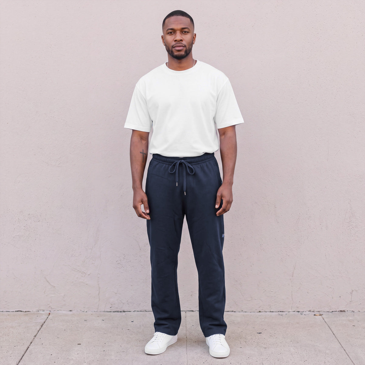 Model wearing Pro Club Men's Comfort Fleece Pants in Navy