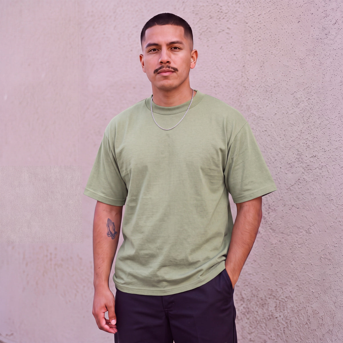 Model wearing Pro Club Men's Heavyweight Cotton Short Sleeve Crew Neck T-Shirt in Olive