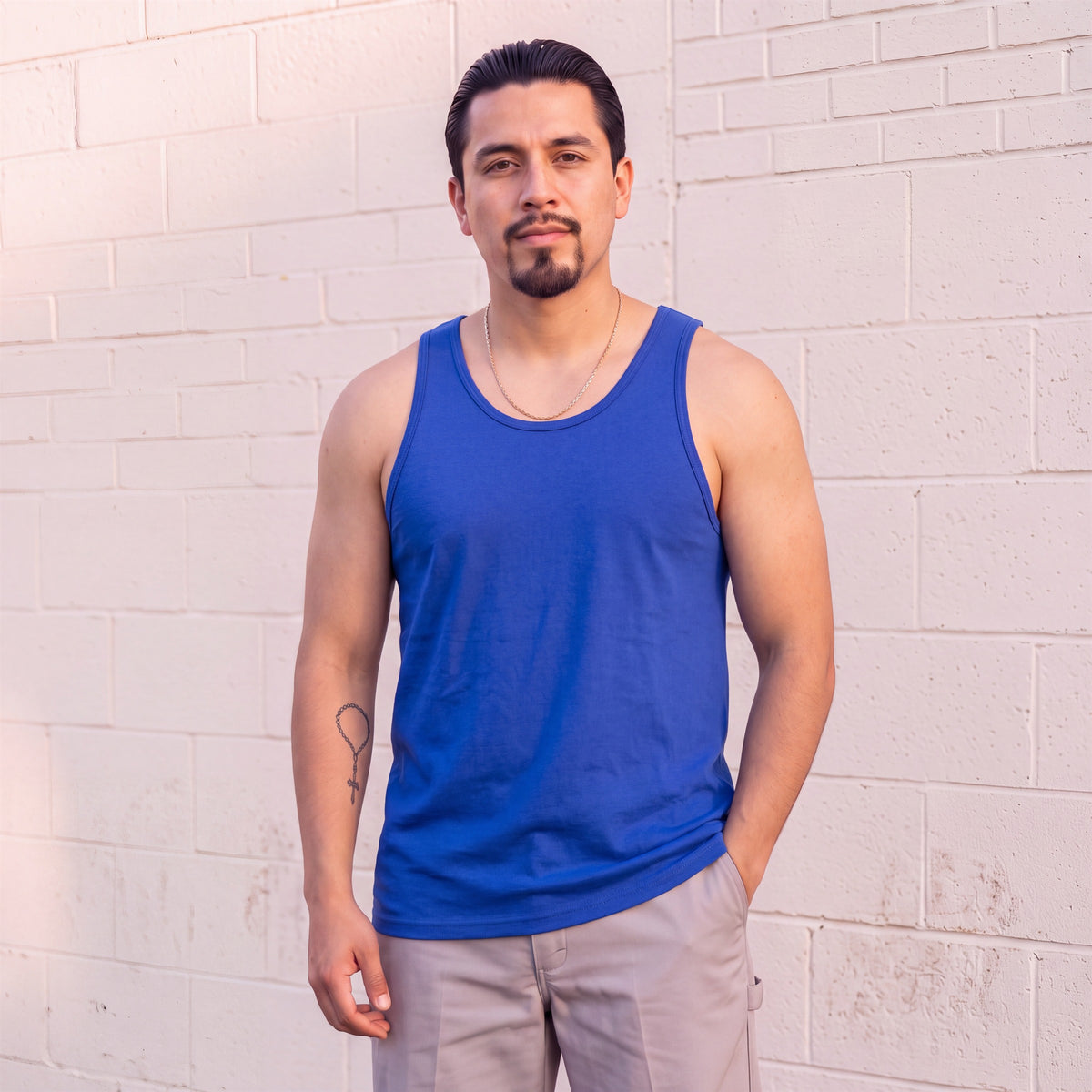 Model wearing Shaka Wear 6.0 Oz Tank Top in Royal