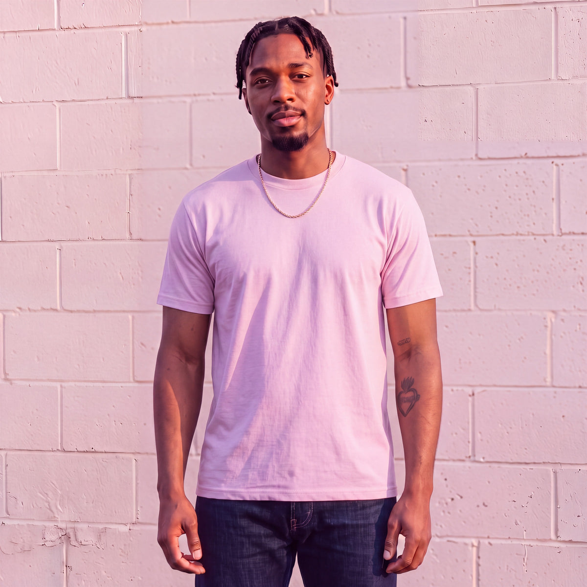 Model wearing Shaka Wear 6.0 oz Active Short Sleeve T-Shirt in Pink