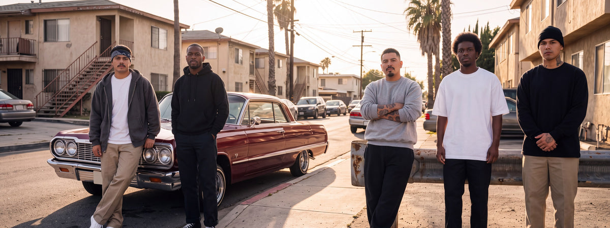 Men in Pro Club heavyweight fleece and tees beside a classic lowrider in East Los Angeles
