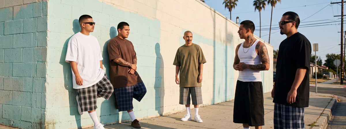 Men in Shaka Wear heavyweight tees and plaid shorts on a Los Angeles sidewalk