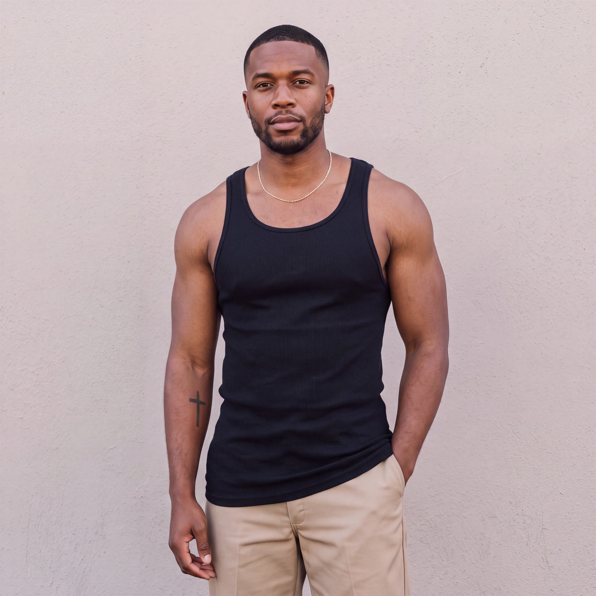 Model wearing Pro Club Men's Premium Ringspun Cotton Ribbed A-Shirt (Muscle Shirt) in Black