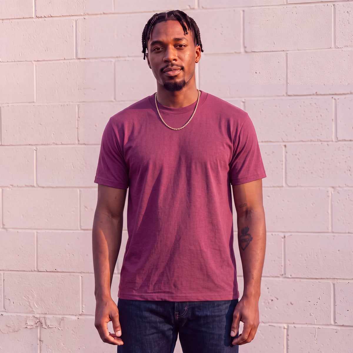 Model wearing Shaka Wear 6.0 oz Active Short Sleeve T-Shirt in Burgundy