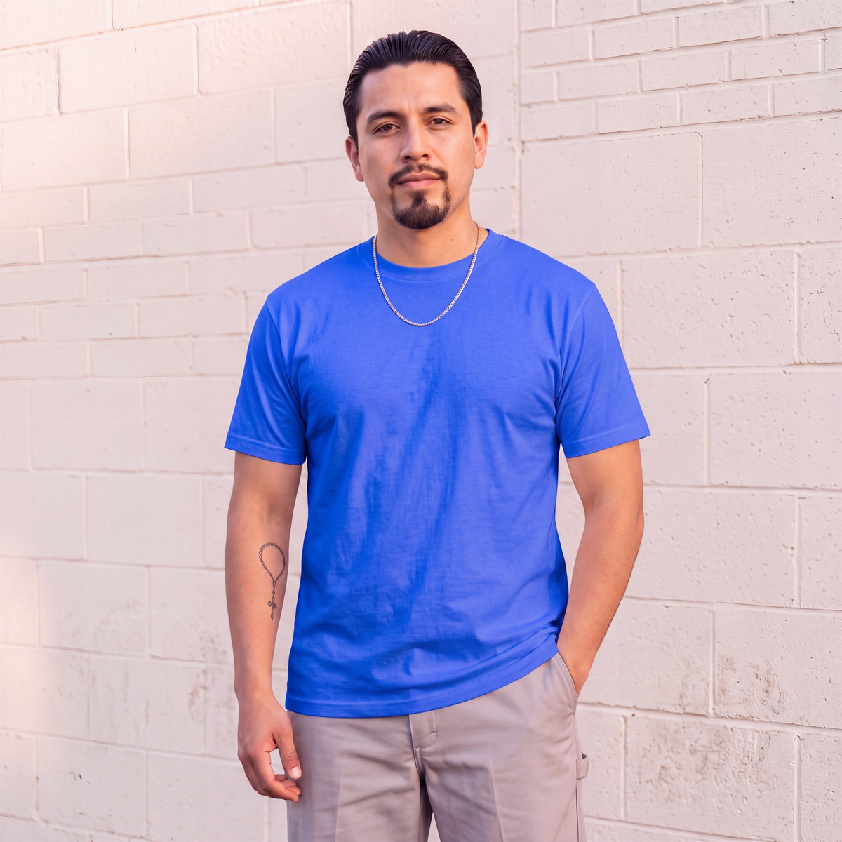 Model wearing Shaka Wear 6.0 oz Active Short Sleeve T-Shirt in Royal